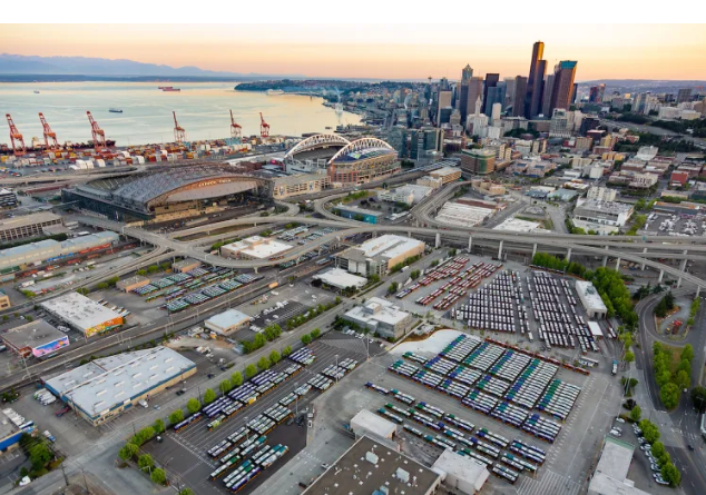 Wide Aerial overview of Atlantic and Central base with the city of Seattle in view