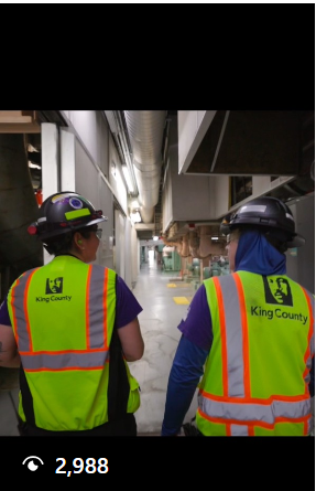 Operators wearing safety vests featuring the King County logo.