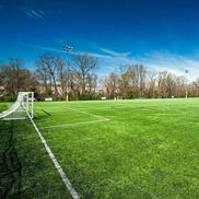 Turf soccer field on a sunny day with blue skies