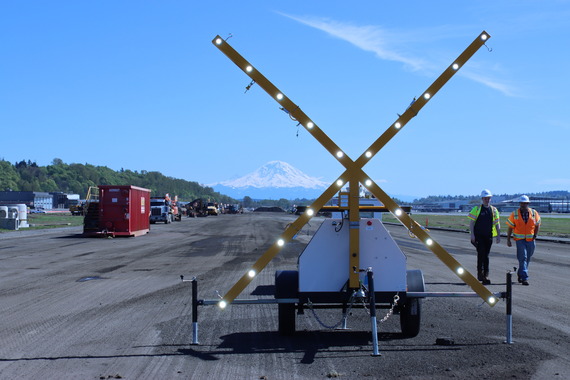 runway construction with Mt Rainier and closed sign
