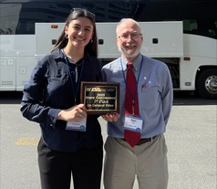 Ella Wilson with teacher and award