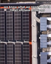 a birds-eye view of solar panels on top of a building's roof