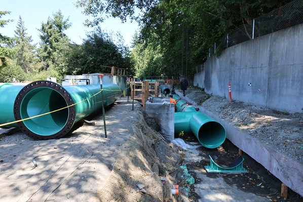 A new section of pipe replacing the old pipe that was at the end of its useful life.