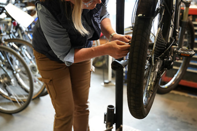 Person fixing a bike 