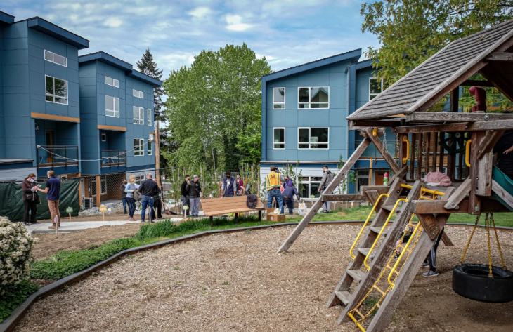 press conference near multifamily buildings