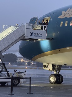 Vietnam president on airplane steps
