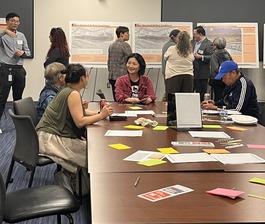 Open house participants at table