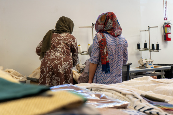 artisans work on a sewing project
