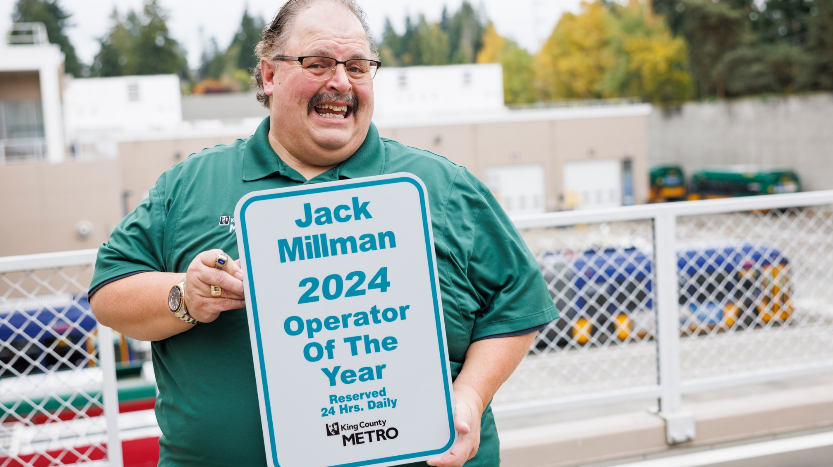 Image of Jack Millman smiling holding a sign" Jack Millman 2024 Operator of the year" and Metro logo