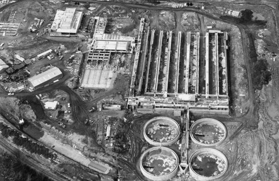 A black-and-white aerial photo showing South Treatment Plant under construction.