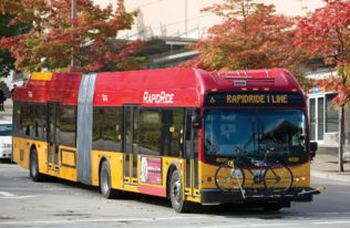 Image of RapidRide I Line bus driving on road 