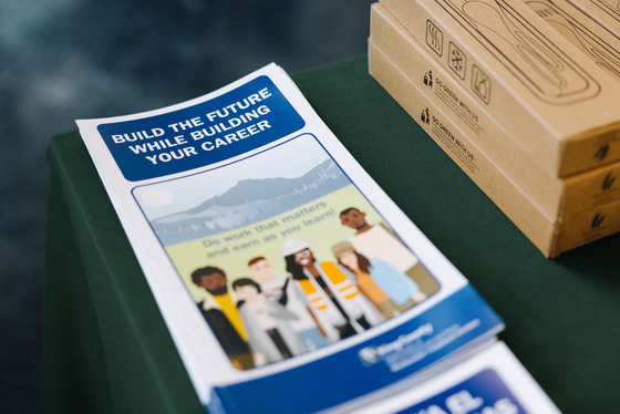 A stack of printed pamphlets titled “build the future while building your career”
