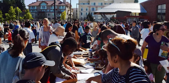 People milling about at a community fair