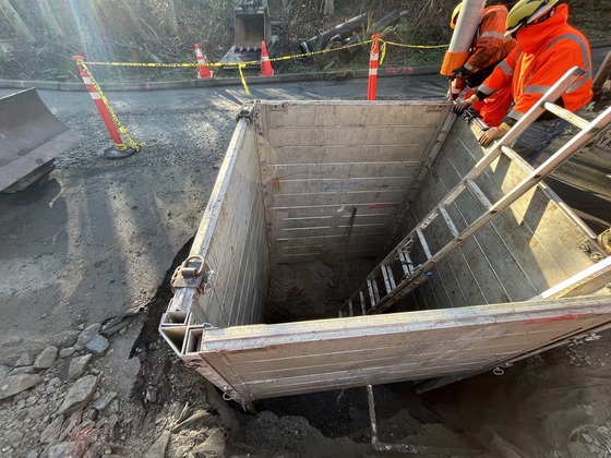 Grey metal trench box on Discovery Park Boulevard