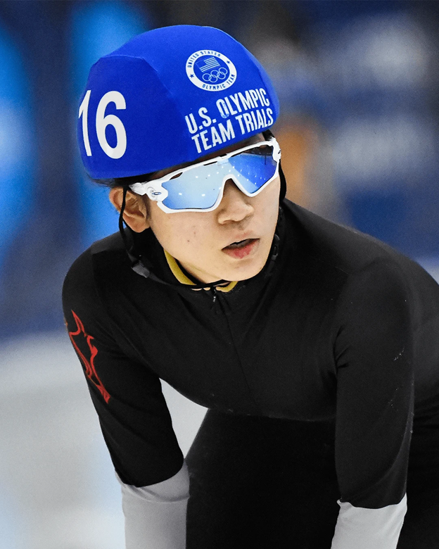 A photo of Eunice Lee in a helmet and goggles in an ice rink