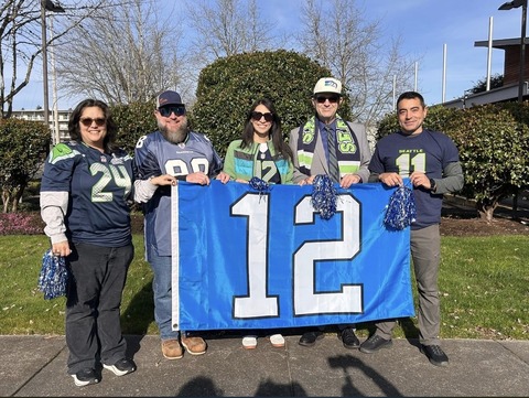Attending the 12th Man flag raising event with Des Moines Mayor, City Councilmembers, and community members. 