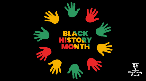 Red, green, and yellow handprints in a circle surrounding the words "Black History Month"