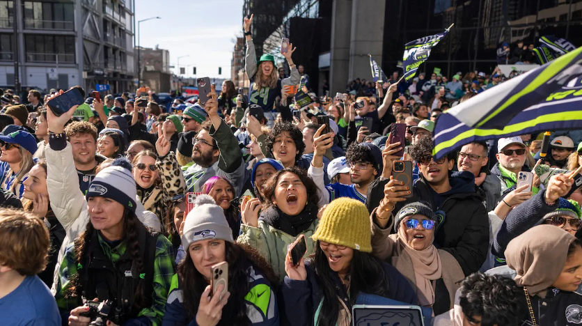 Image of a happy crowd in downtown Seattle for the Seahawks parade