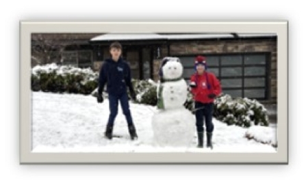 two boys playing in the snow