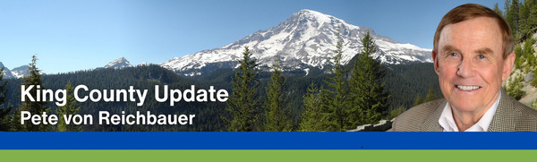 King County Update: Pete von Reichbauer, with a mountain range and trees in the background.