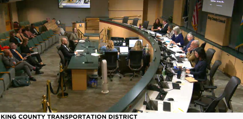 A screenshot of a video of the KCTD with the supervisors sitting at the King County Chambers dais
