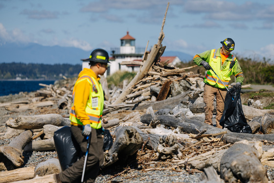 West Point operations team members cleaning the beach.
