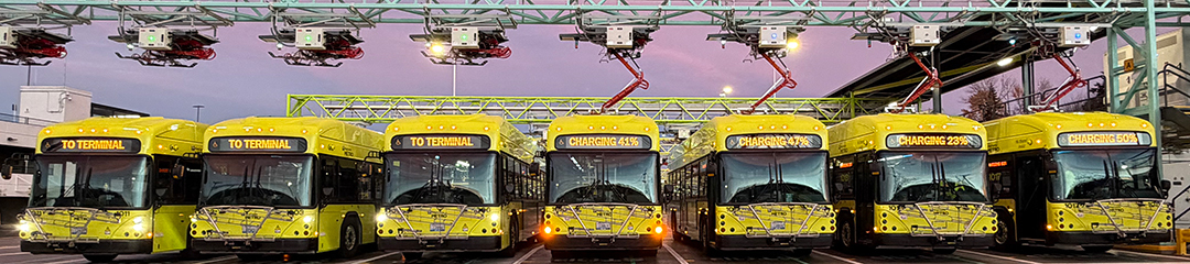 Buses charging using overhead infrastructure at Tukwila base