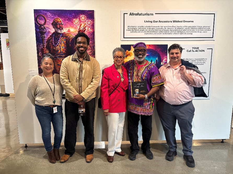Photo of CM Lewis and her staff standing in front of art at the King Street Station.