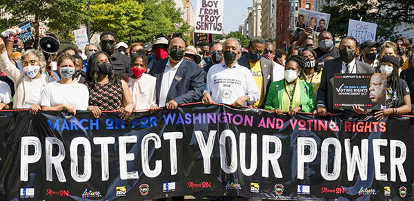 Protect Your Power sign at a protest.