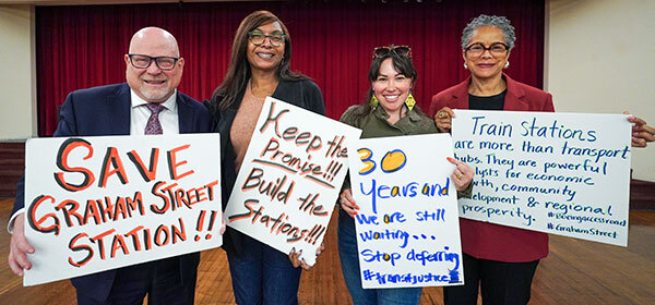 CM Lewis with others holding signs: Save Graham Street Station".