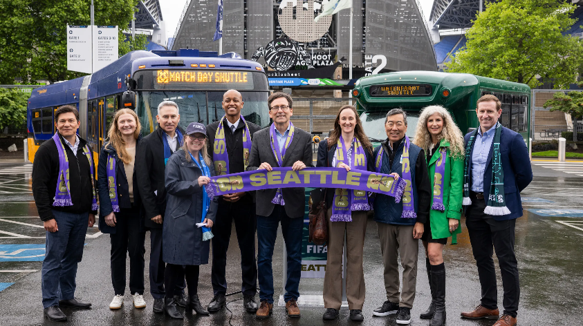 image of buses in front of Lumen Field with the Governor, County Exec, and Seattle Mayor and other elected officals