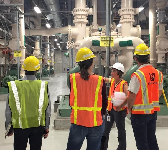 People wearing personal protective equipment being led on a tour of South Plant