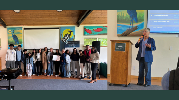 Left: Group of people line up for a photo in front of a wall of paintings. Right: A woman in a blue suit speaks into a microphone.