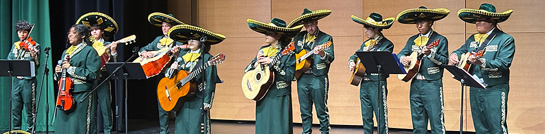 Mariachi band performs on stage