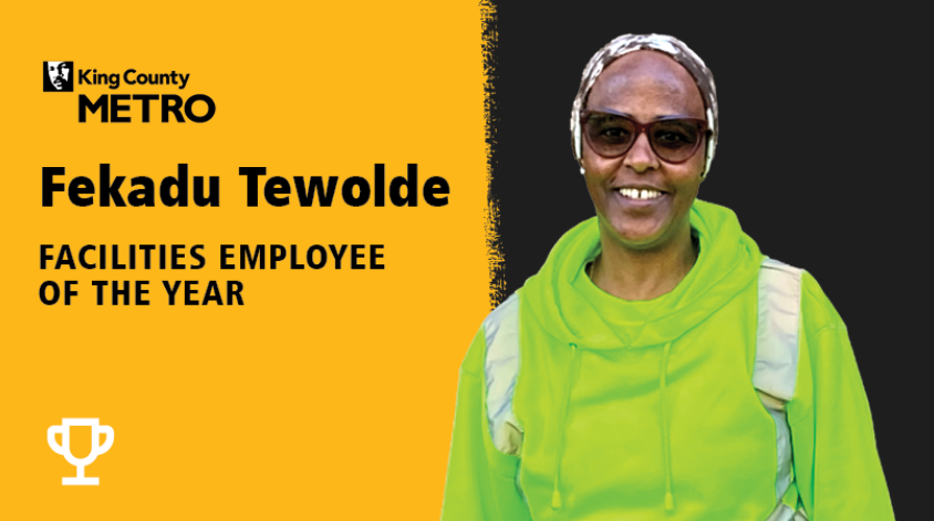 Text: "Fekadu Tewolde Facilities Employees of the year" and a picture of Fekadu Tewolde
