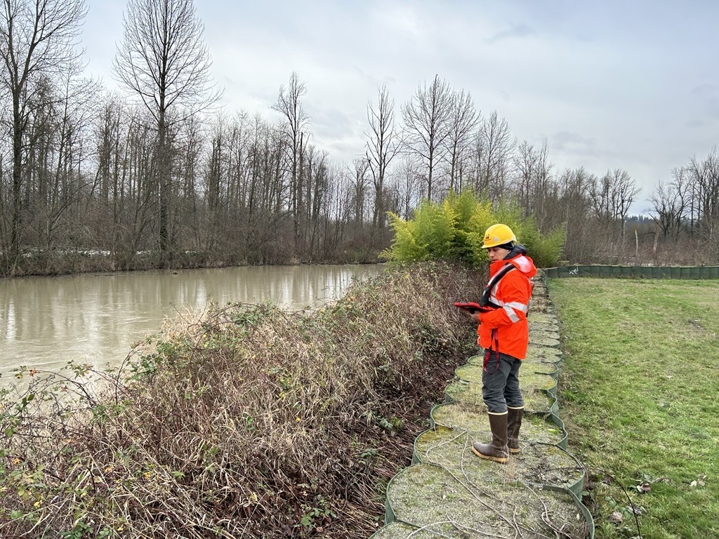 A staff member monitors the White River after December floods