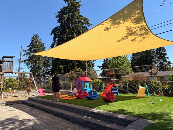Sun shade sail over play equipment