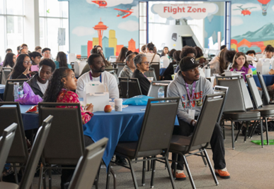 Students sit at tables during the King County Youth Leadership Summit.