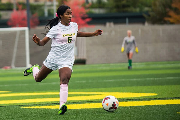 photo of a person kicking a soccer ball