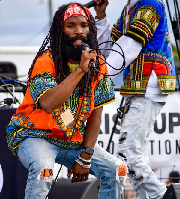 image of man singing on stage