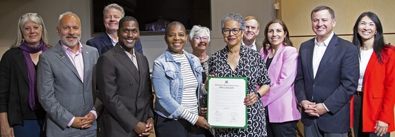 A group of King County Councilmembers with Northwest African American Museum representatives receiving the proclamation document. 