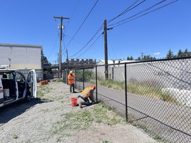 maintenance crews work on fence
