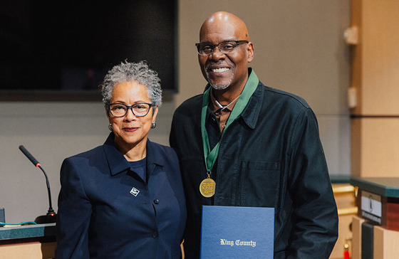 Image of Councilwoman Rhonda Lewis standing alongside Gregory Davis who is wearing the MLK Day of Honor Medal 