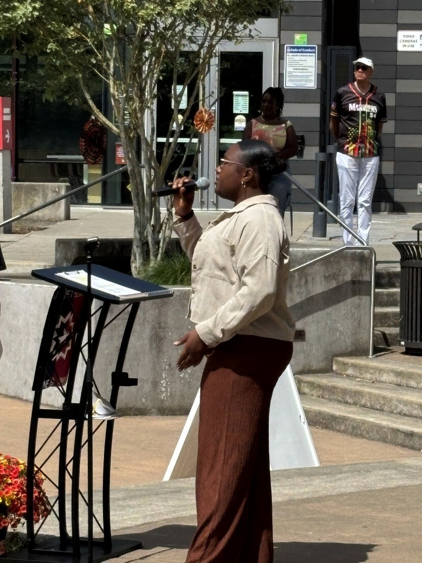 Jayza Duhon singing at Juneteenth celebration