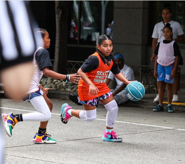 Young girl playing Basketball
