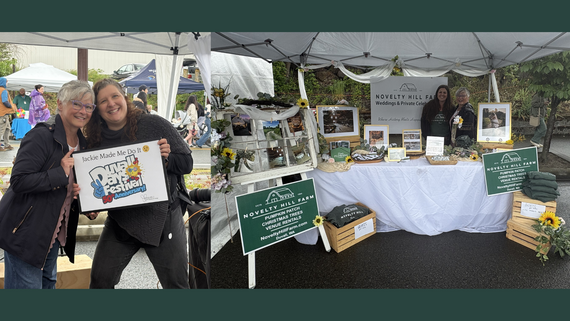 Left: Two women pose with a sign reading Duvall Days Festival. Right: Two women stand, smiling, under a white tent.