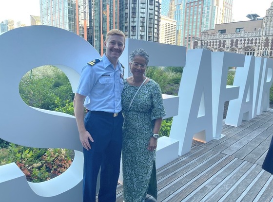 Councilmember Lewis alongside Coast Guard Lt Fager at the Seafair Reception
