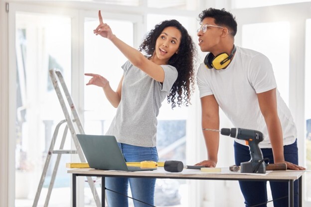 Two people doing home renovations