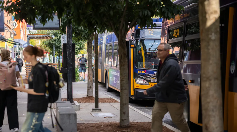 Riders exit buses in Seattle's University District, where new Route 72 now operates.