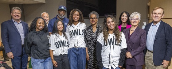 A group photog featuring individuals gathered together in the Council Chambers.